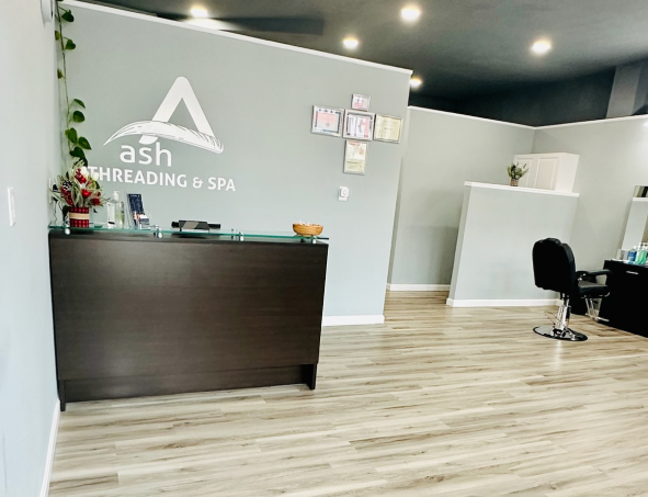 Reception desk and salon interior at Ash Threading & Spa
